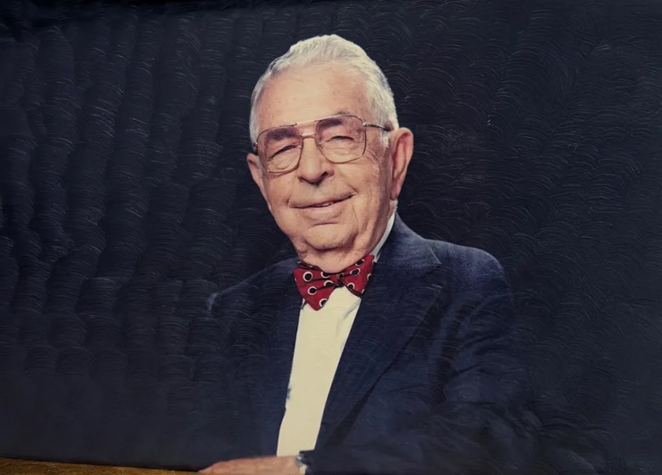Portrait of John Art Phillips Sr. Man in suit jakcet and red bow tie